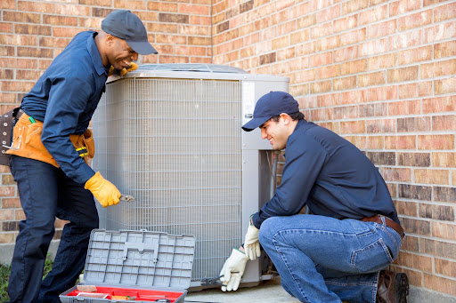 Team working on summer ac maintenance.